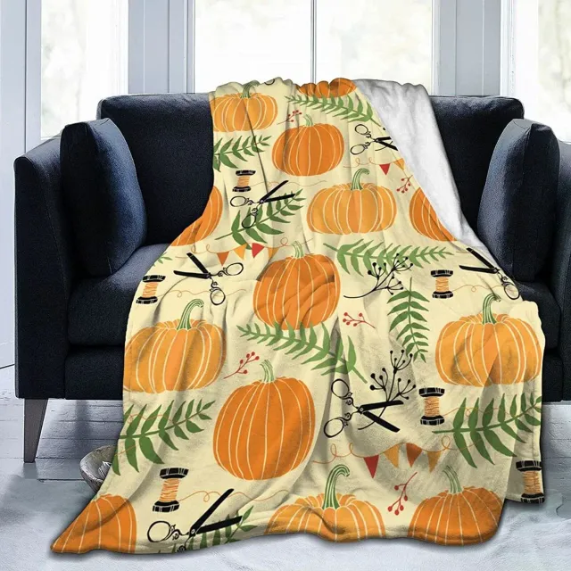 Autumn flannel blanket with a motif of pumpkins and leaves for sofa, bed or couch