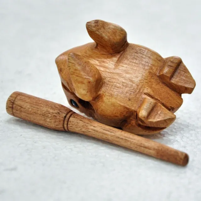 Wooden frog with a cane