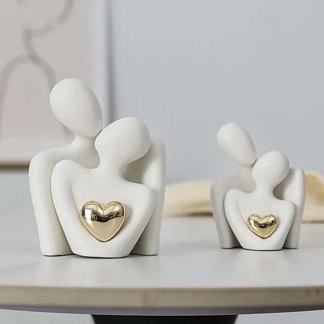 Decorative ceramic figure with motif hug and gold heart