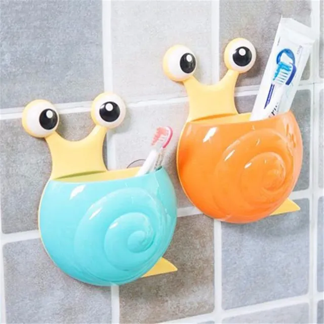 Cheerful toothbrush holder in the shape of a snail