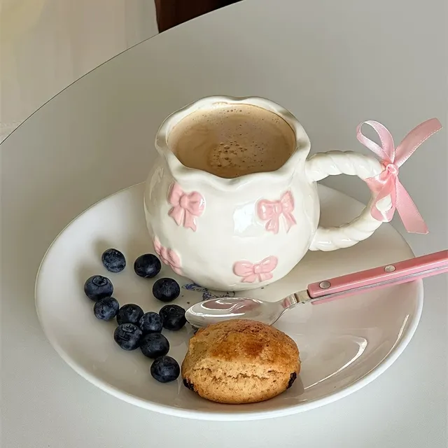 Handmade ceramic mugs with irregular bow patterns - ideal for home cooking