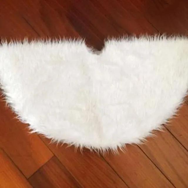 Hairy rug in white under the Christmas tree