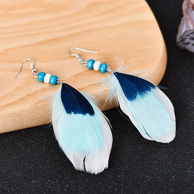 Women's dangle earrings with feathers