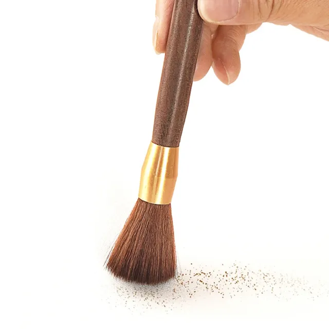 Brush for cleaning coffee from a grinder with wooden handle