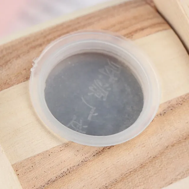 Practical wooden cash box in the shape of a barrel