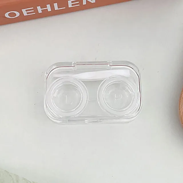 Miniature contact lens case made of clear plastic