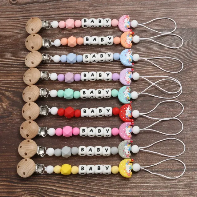 Silicone pacifier clip with motif of moon and bite