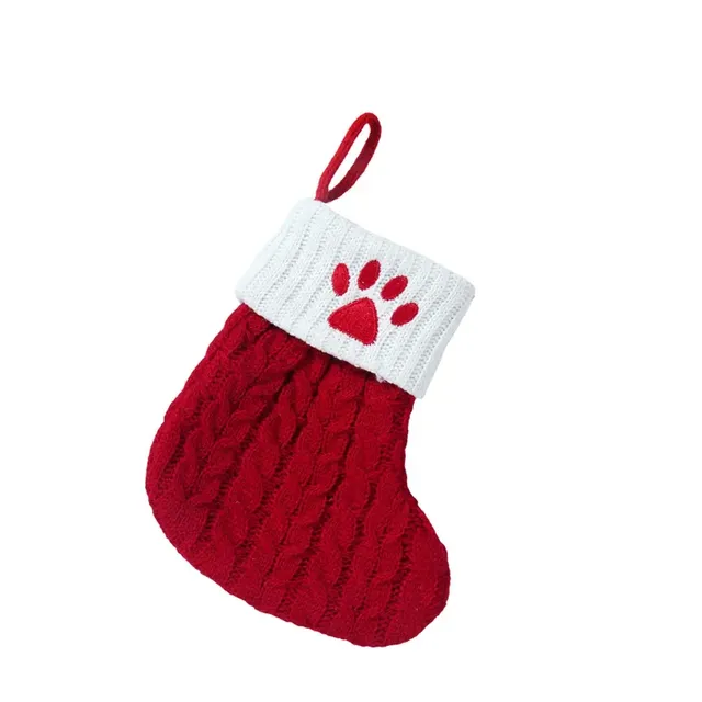 Cute stocking with Christmas motifs and knitted paw pattern