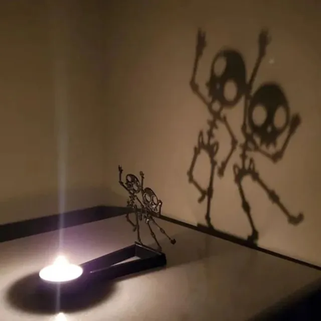 Kreativní projekční svícen pro Halloweenskou atmosféru s projekcí stínu děsivých svíček