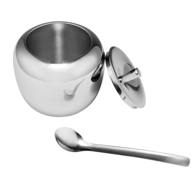 Stainless steel sugar with a spoonful of apple