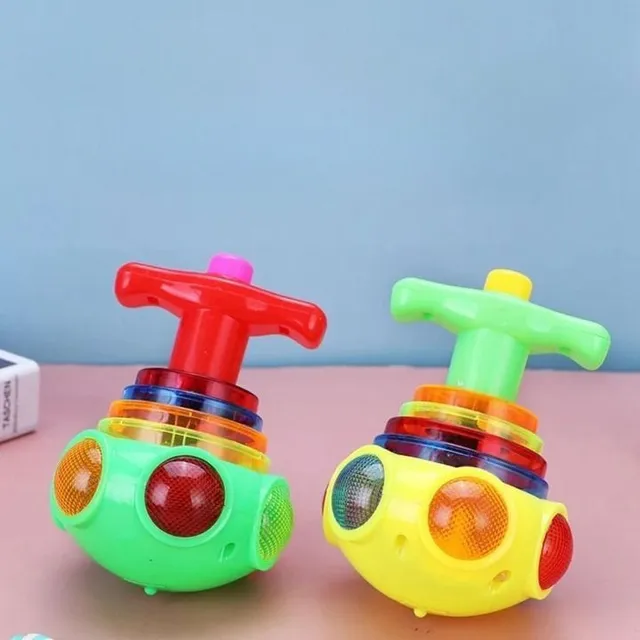 Colour spinning toy with trigger