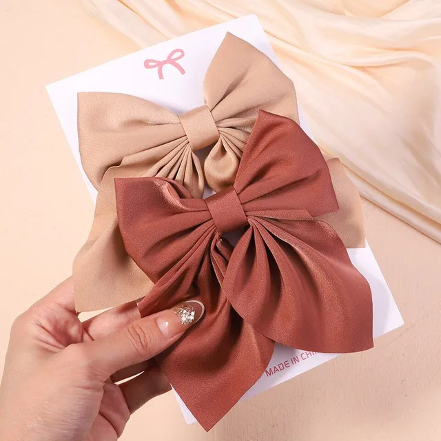 Cute modern baby hair clip with perfect bow motif - more variants
