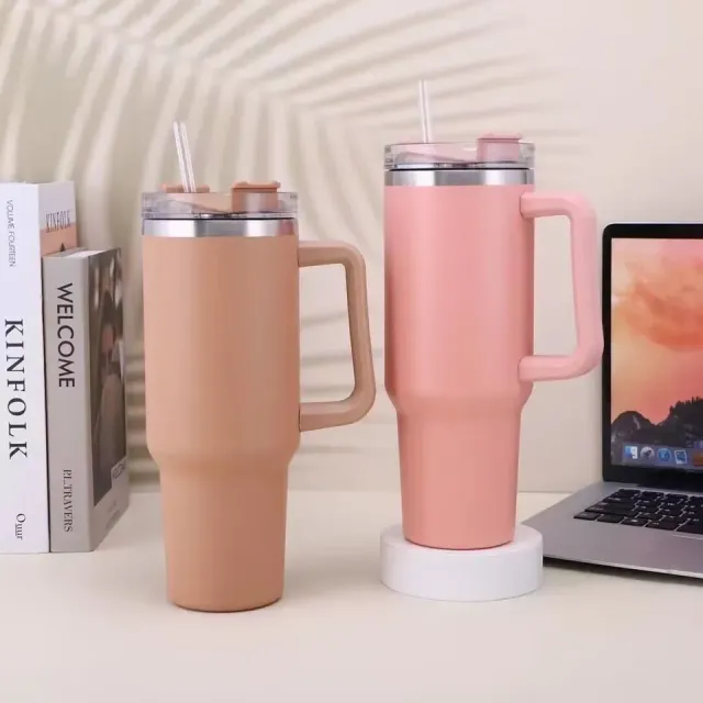 Isolated coffee cup with straw and handle for travel