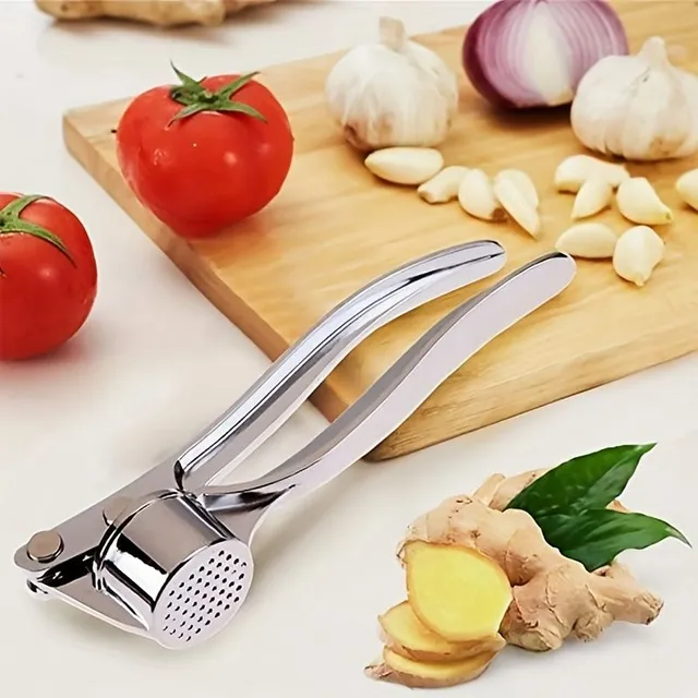 Hand-operated garlic and ginger press of metal