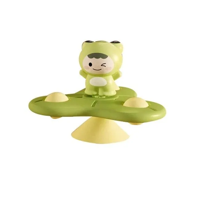 Rotating toy with suction cup