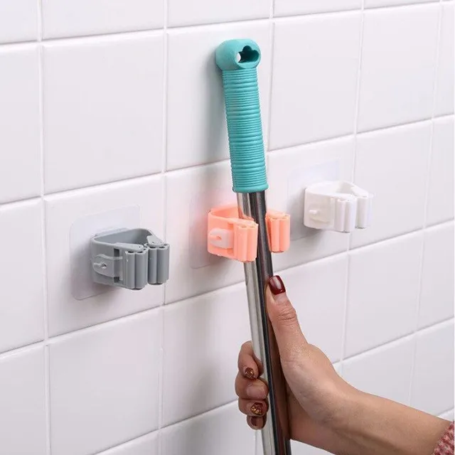 Practical holder for mop or broom