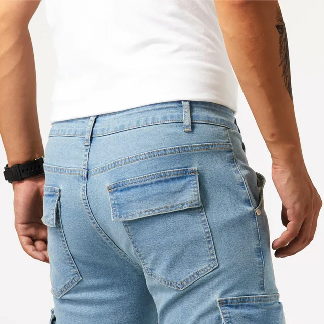 Male cargo jeans slim cut with multiple pockets, medium elastic denim fabric, leisure street style