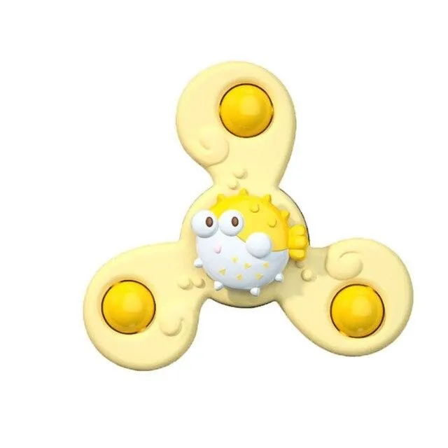 Rotating toy with suction cup for small children