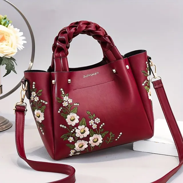 Elegant bag with floral embroidery and removable strap