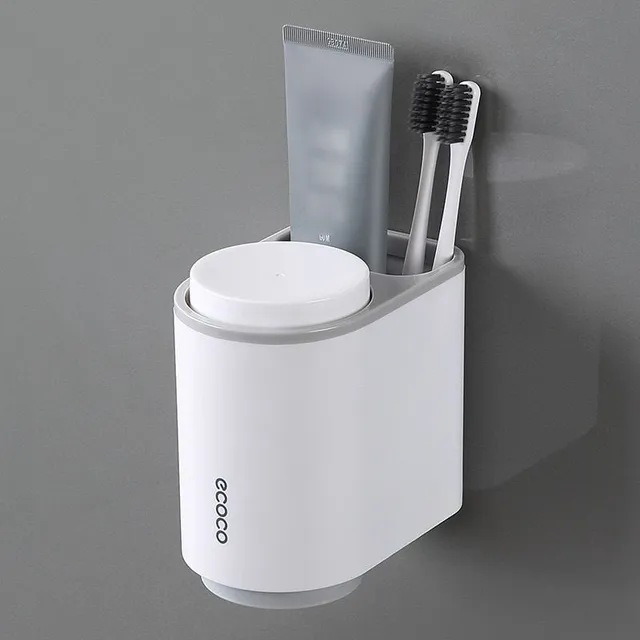 Toothpaste dispenser with toothbrush holder and paste