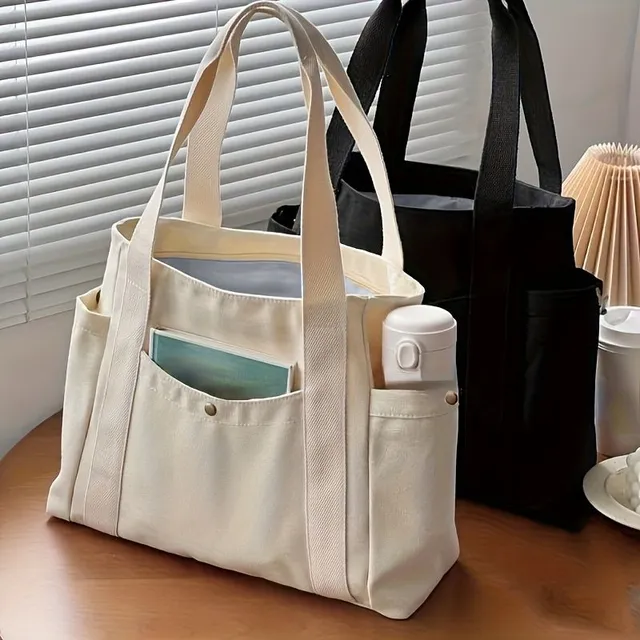 Tote bag with literary motif, more pockets, occasional shoulder cable for school, work and town