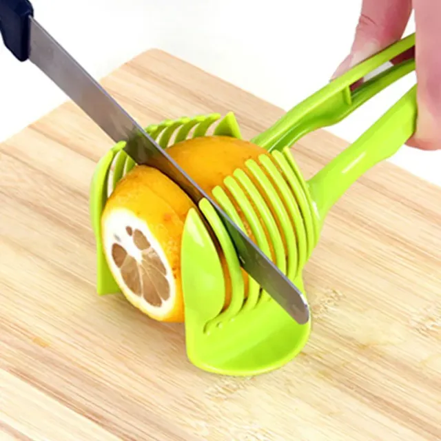 Practical helper in cutting tomatoes and other fruits and vegetables - green color