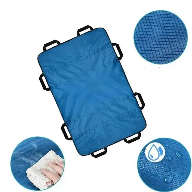 Insoluble bed positioning pad with reinforced handles