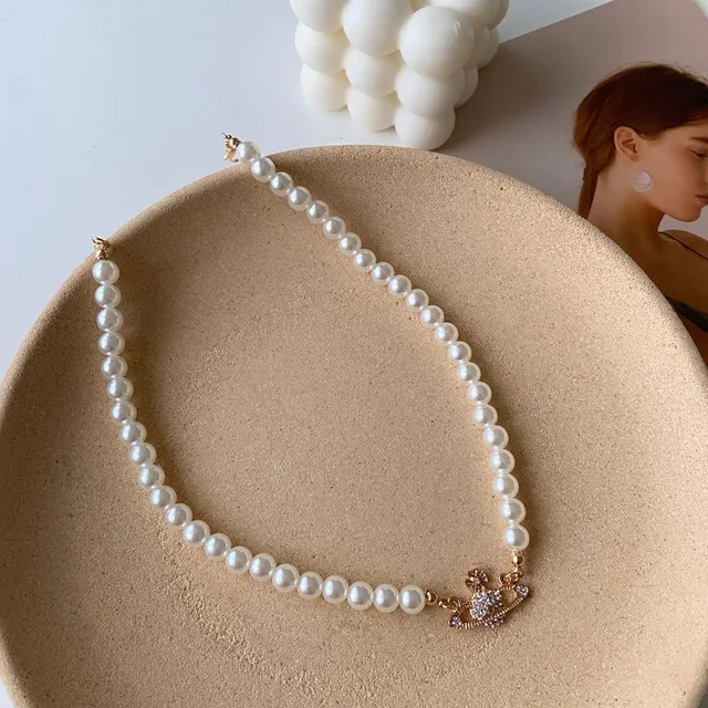 Saturn pearl necklace