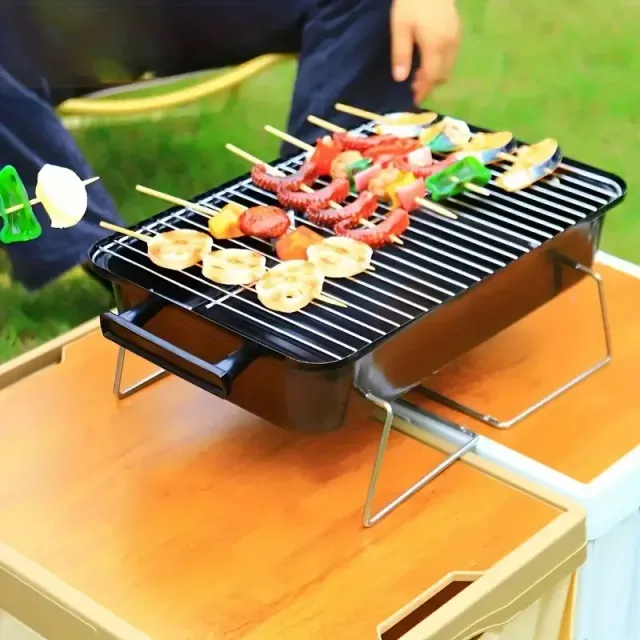 Portable Grill On Wooden Coal For Outdoor Camping