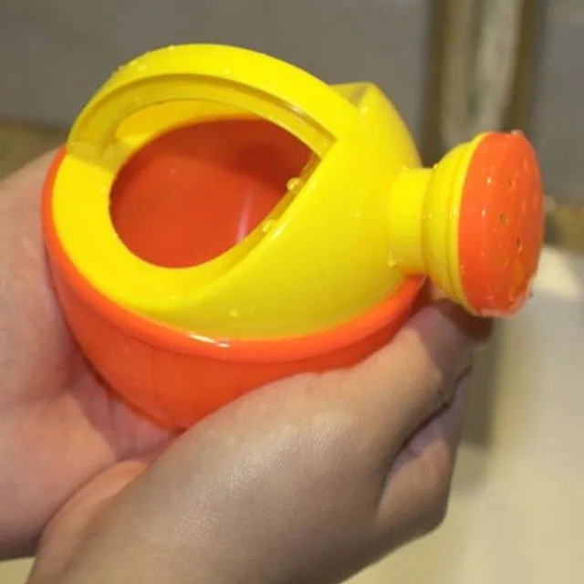 Plastic teapot with a sprinkle for children