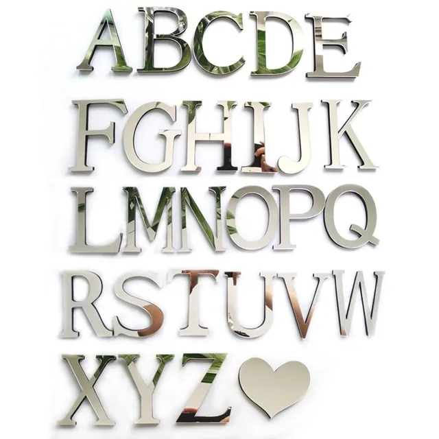 Adhesive mirror letters on the wall