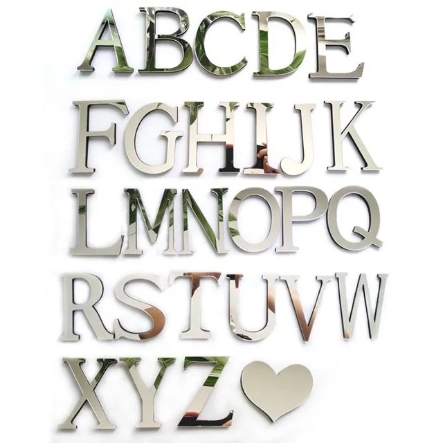 Stick-on mirror letters on the wall