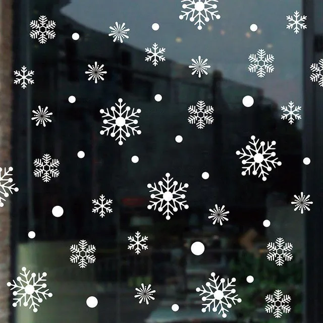 Beautiful Christmas stickers in the shape of a snowflake on the window