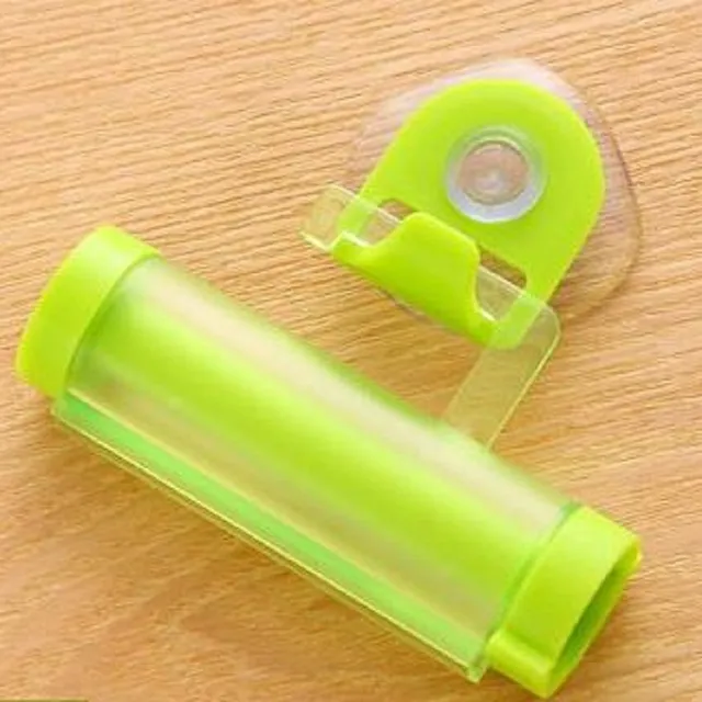 Toothpaste squeezing aid green