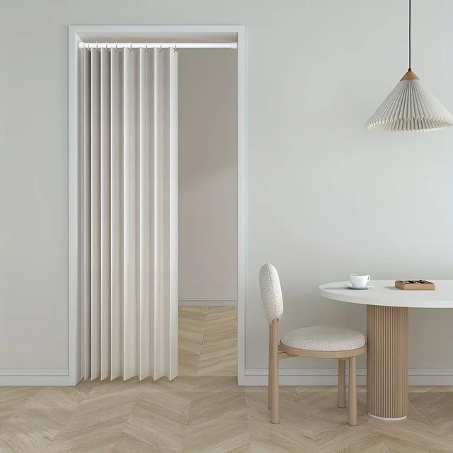 Folding screen of corrugated design for space distribution