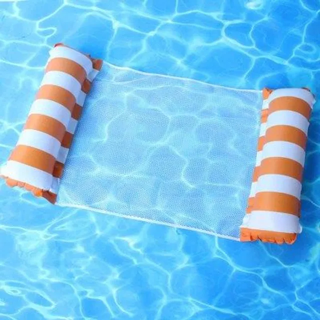 Foldable inflatable lounger for water