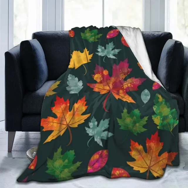 Autumn flannel blanket with a motif of pumpkins and leaves for sofa, bed or couch