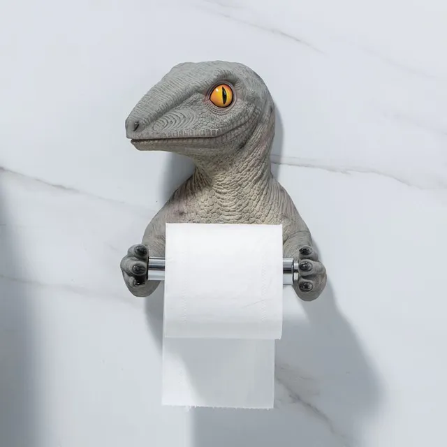 Toilet paper holder in the shape of a dinosaur
