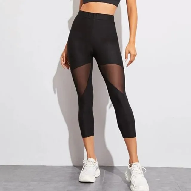Women's modern trendy sports elastic leggings with meshed detail on their pants
