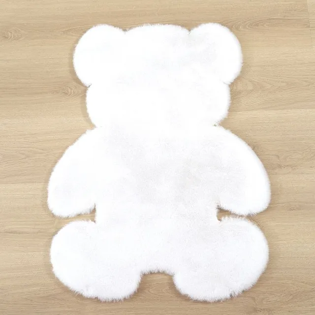 Soft rug in the shape of a teddy bear