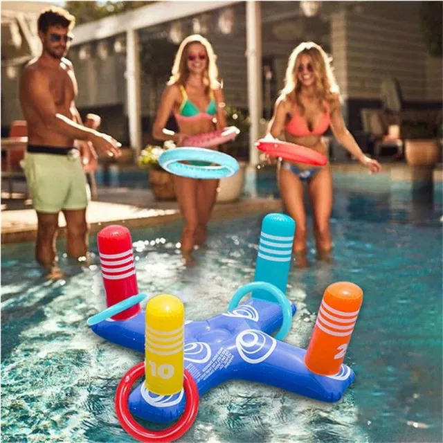 Game throwing rings on an inflatable cross into the pool