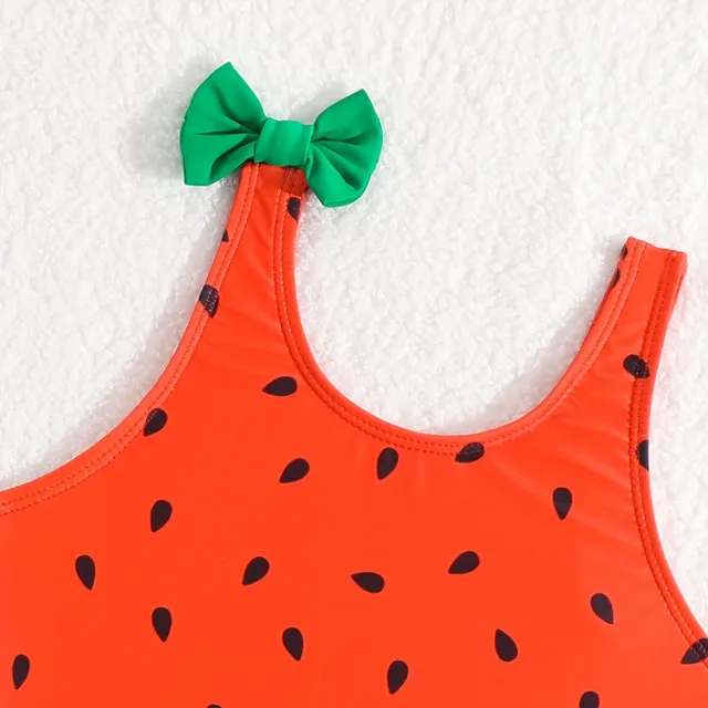 One-piece swimsuits for girls with a motif of watermelon and bows on hangers