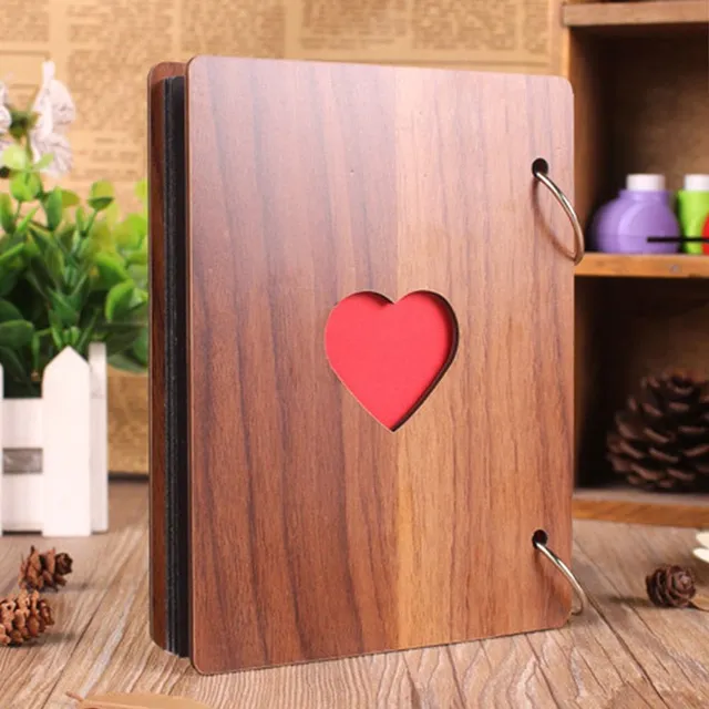 Wooden photo album with a heart in the middle