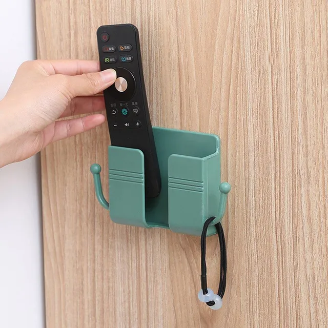 Wall holder of mobile phone with hole for cable and hooks