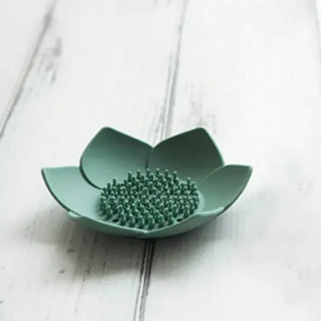 Soap silicone tray in the shape of a lotus with draining into the bathroom
