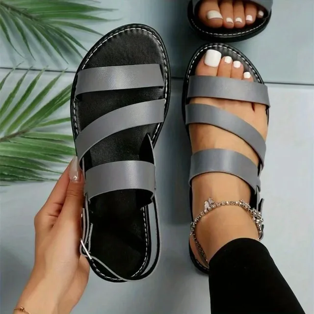 Women's sandals of Roman type, monochrome, with open round toe, with belt around the ankle, occasional beach sandals