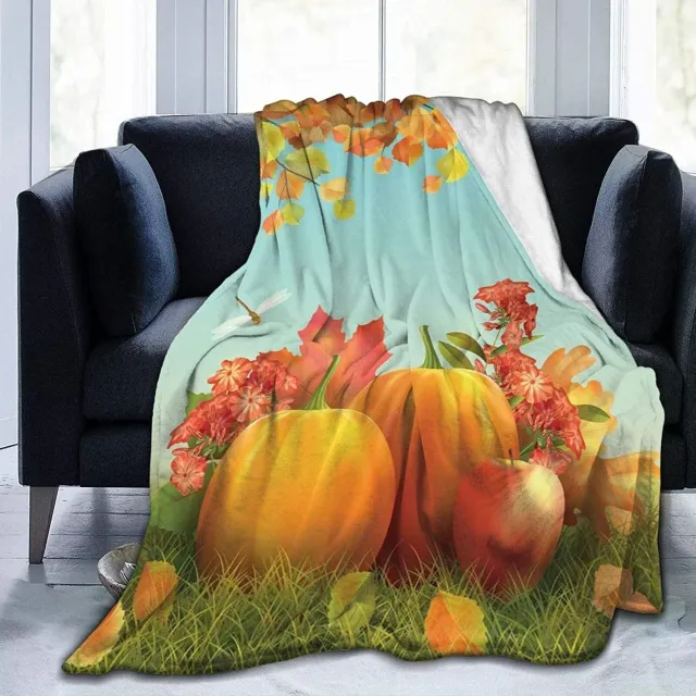 Autumn flannel blanket with a motif of pumpkins and leaves for sofa, bed or couch