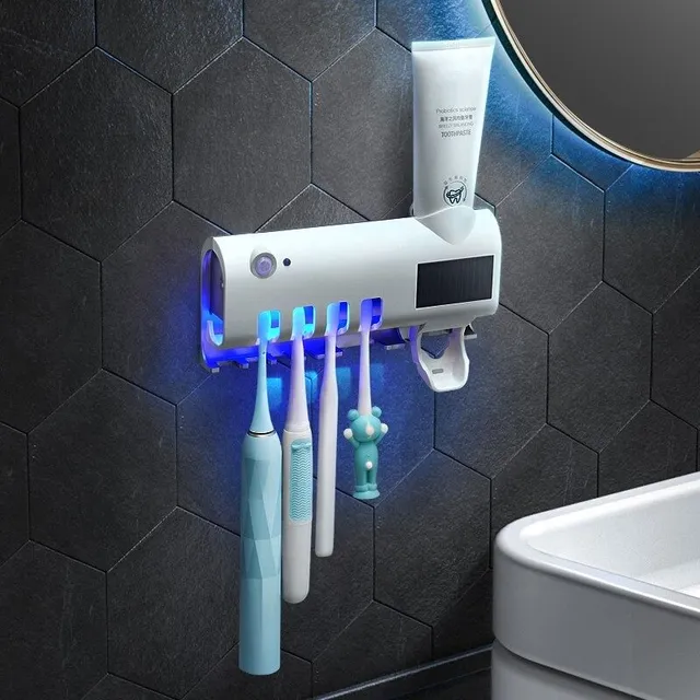 Toothbrush holder with paste dispenser