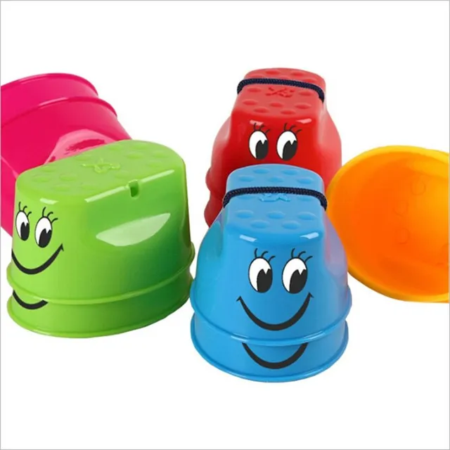 Children's colored plastic stilts with smiley face