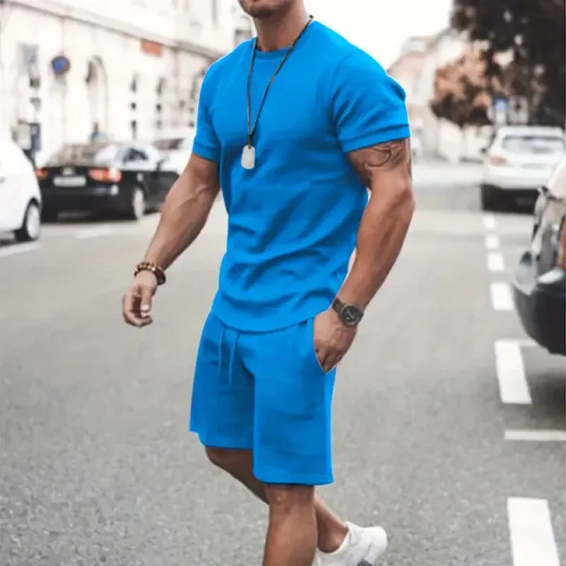 Male two-piece set made of smooth fabric, T-shirt with round neckline and shorts with string and pockets